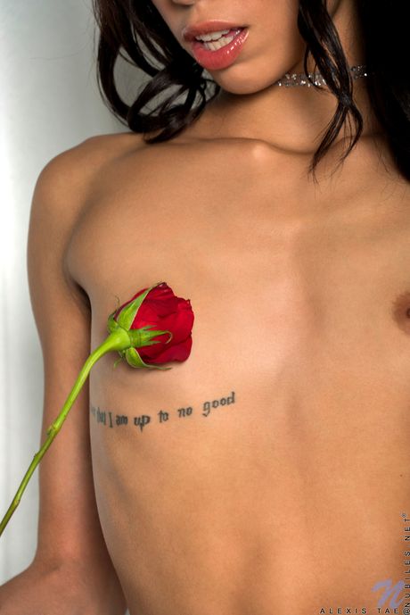 Sexy nurse Alexis Tae shows off her slim body and her shaved pussy