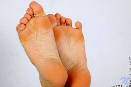 Flexible teen Natalia Illarionova goes naked in white socks and sneakers