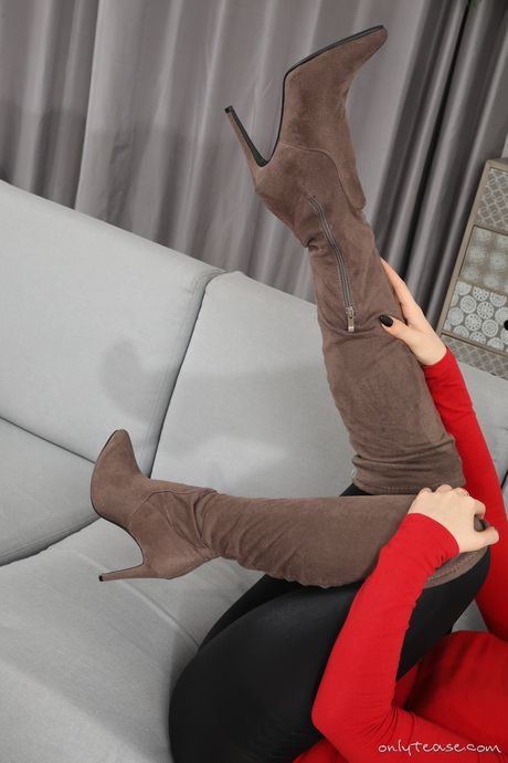 Stunning dark-haired Mystery Model strips to her stockings and poses in them