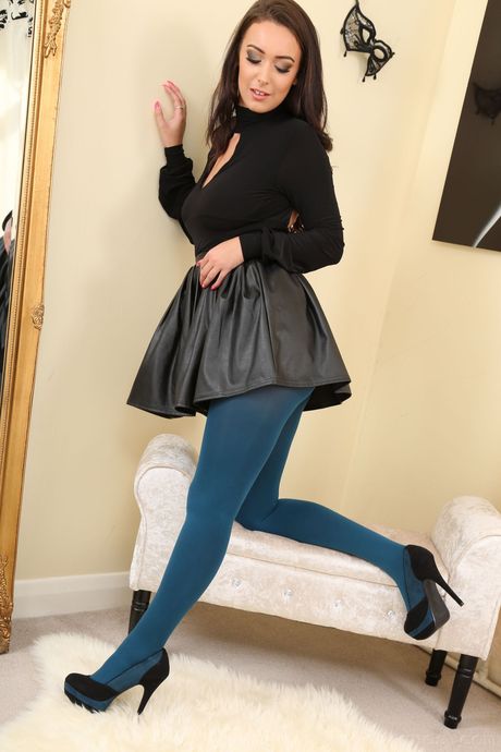 British Milf Lauren Louise strips to her stockings and poses in a solo