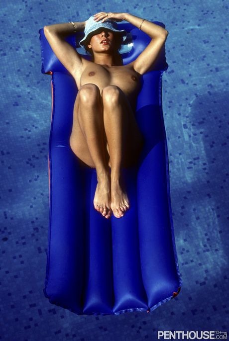 Brunette babe Julia Perrein highlights her big tits and hairy pussy outdoors