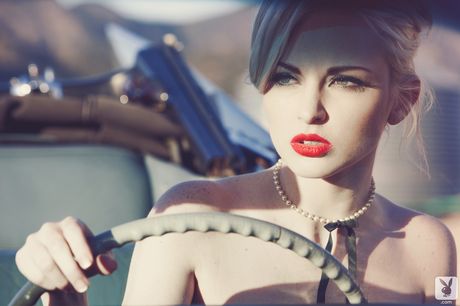 Blonde playmate Carissa White demonstrates her small tits and unveils herself in the nude