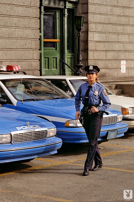 Blonde policewoman Carol Shaya strips and shows her natural tits