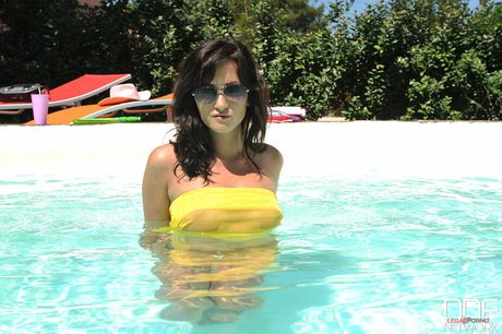 Beautiful teen Tess toys her shaved pussy with a bubble wand outdoors