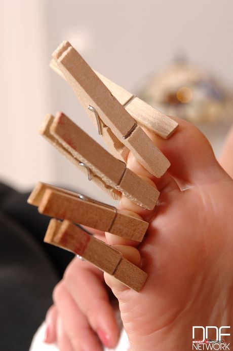 Blonde cougar Zuzana Z. whips her Asian slaves feet with a cane