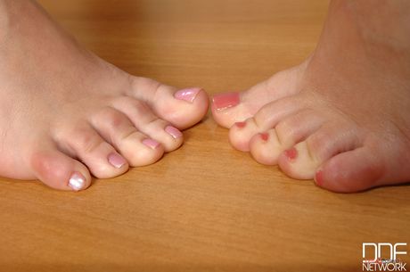 Light-haired schoolgirls Yasmine Gold and Weendy White have foot fetish sex