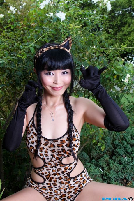 Asian doll Marica Hase demonstrates her big melons and poses in a leopard print