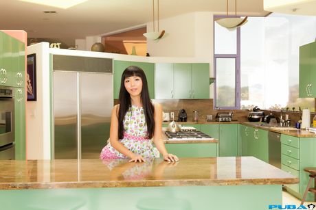 Asian cutie Marica Hase removes her dress and displays her tits in a solo