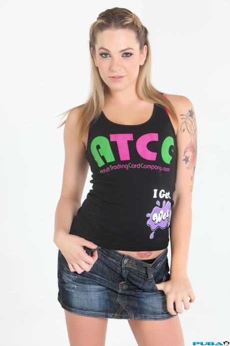 Inked american blonde Dahlia Sky presents her tits and ass in a solo show