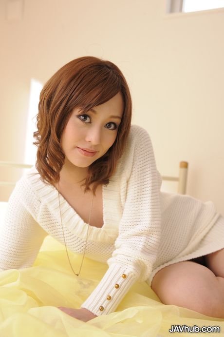 Brown eyed beauty Miina Yoshihara displays her hot body and poses