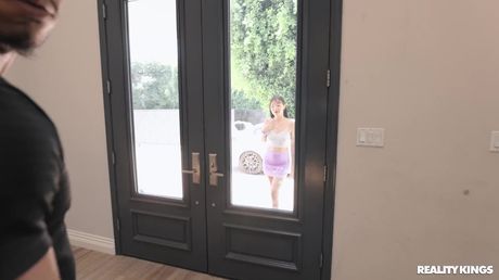 Asian girl Elle Lee has sex with a black man on a sofa