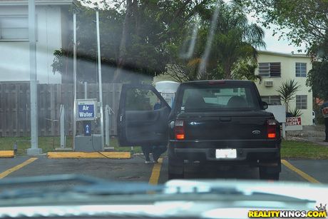 Blonde american cougar Amber Irons has sex with a younger man on a sofa