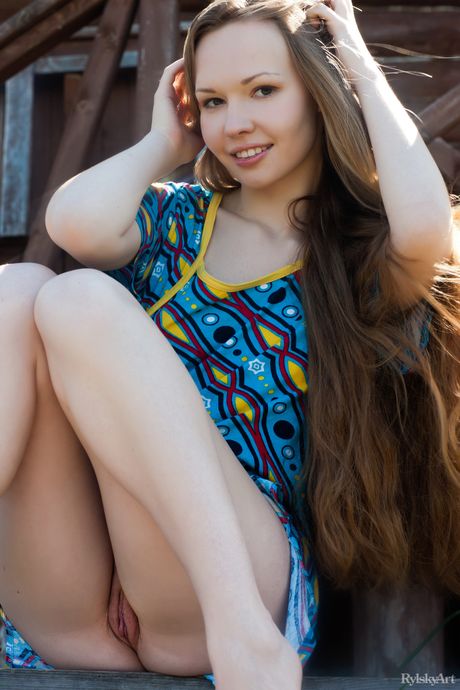 Shapely dark-haired young Virginia Sun in fancy skirt exposes small tits and spreads her legs outside