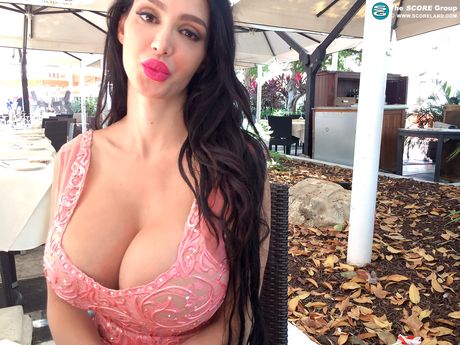 Brunette Amy Anderssen unveils her amazing racks and poses in a solo