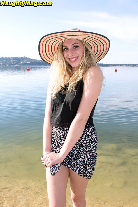 Enticing cutie Camille in sexy skirt exposing big knockers and hot ass on the beach