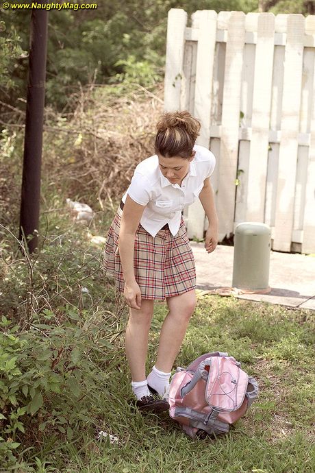 Naughty schoolgirl Amateur strips and presents her big ass outdoors