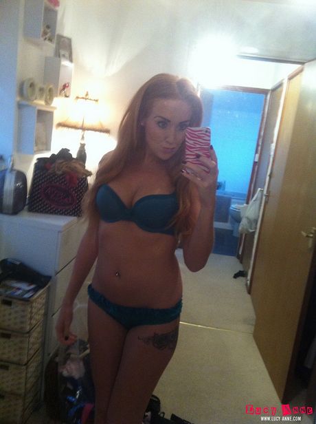 Gorgeous czech blonde Lucy Anne gets naked in a sexy manner in a bedroom