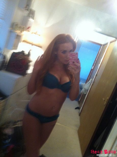 Gorgeous czech blonde Lucy Anne gets naked in a sexy manner in a bedroom