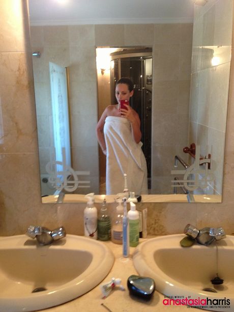 British playmate Anastasia Harris exhibits her big melons and her shaved pussy