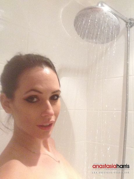 Wonderful British MILF Anastasia Harris disrobes for the camera and masturbates in the shower