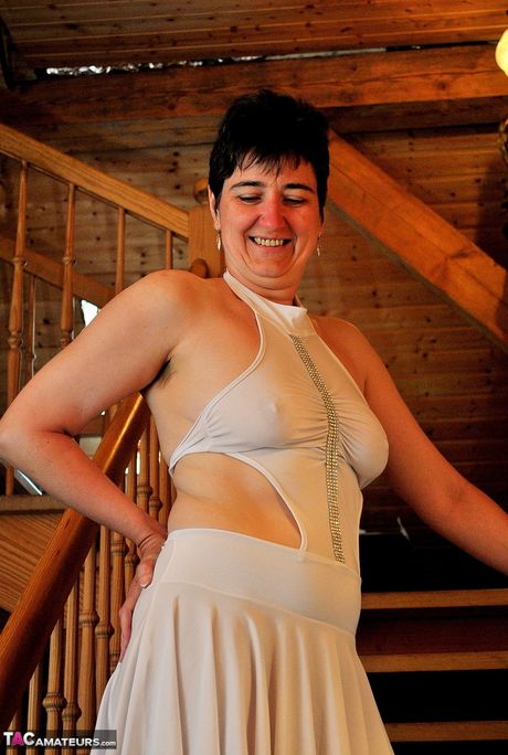 Mature german dark-haired Hot Milf strips to her boots and highlights her perfect ass