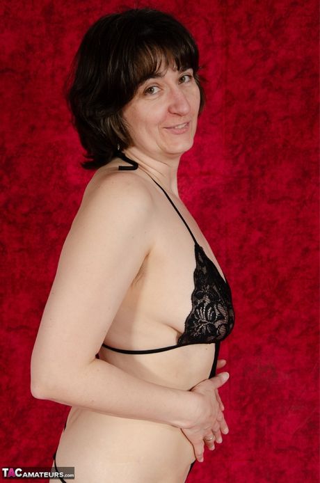 Hot german mature Hot Milf demonstrates her big melons and poses in her black lingerie