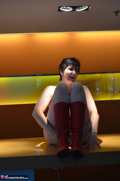 Nice german mature Hot Milf strips to her boots and presents her huge tits