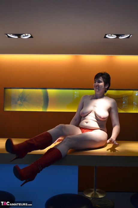 Nice german mature Hot Milf strips to her boots and presents her huge tits