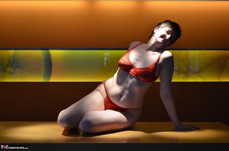 Nice german mature Hot Milf strips to her boots and presents her huge tits