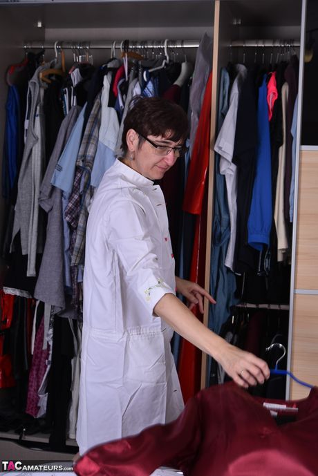 Nice german mature in glasses Hot Milf strips and flaunts her sexy ass