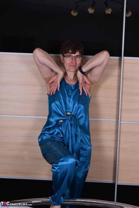 Devastating german mature lady in glasses stripping and spreading her legs