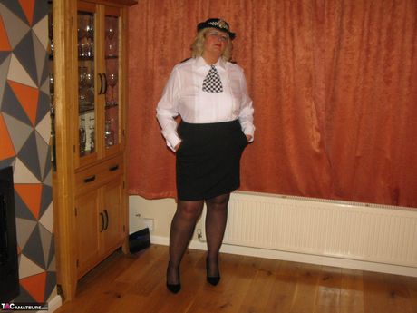 Light-Haired british mature Chrissy Uk strips to her stockings and poses in a uniform