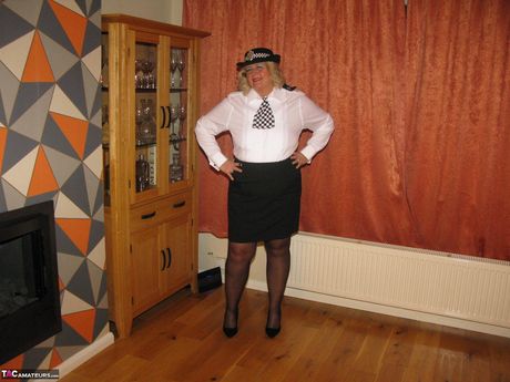 Light-Haired british mature Chrissy Uk strips to her stockings and poses in a uniform