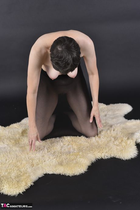 Mature german dark-haired Hot Milf strips to her stockings and poses in a solo