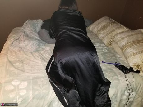 Brunette american MILF Sexy Ne reveals her amazing racks and ass before masturbating