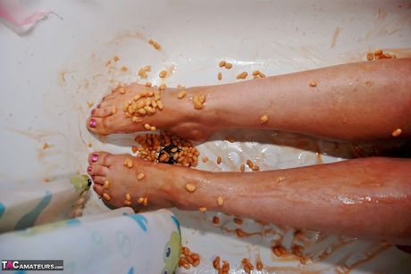 Adult british lady Janey gets naked before bathing in a tub