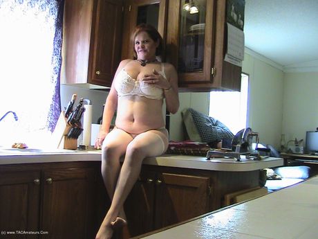 Mature Misha Milf strips to her boots and toys her horny pussy