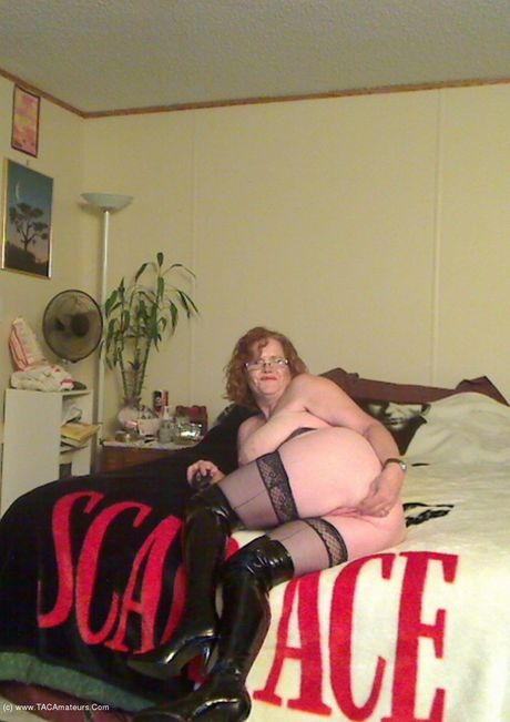 Mature canadian lady Misha Milf plays with her pussy in a black leather dress