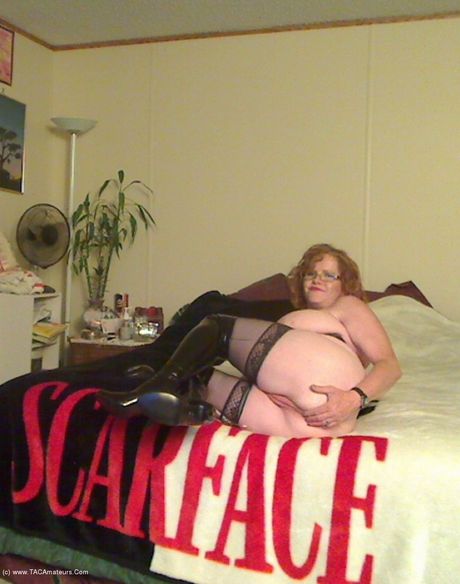 Mature canadian lady Misha Milf plays with her pussy in a black leather dress