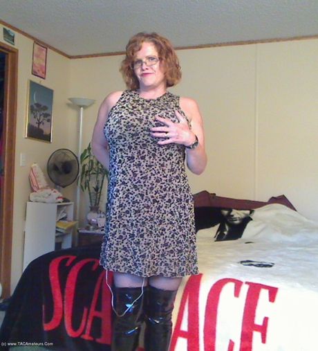 Mature canadian lady Misha Milf plays with her pussy in a black leather dress