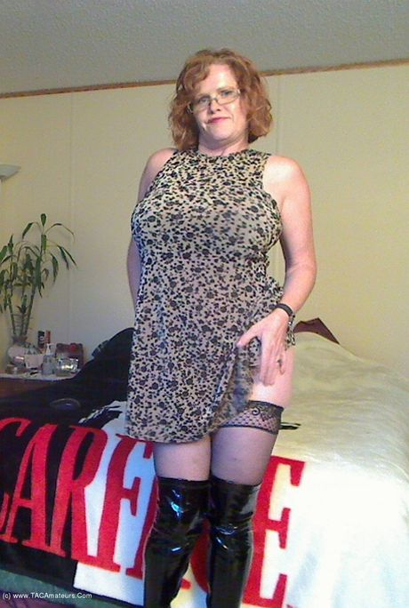 Mature canadian lady Misha Milf plays with her pussy in a black leather dress