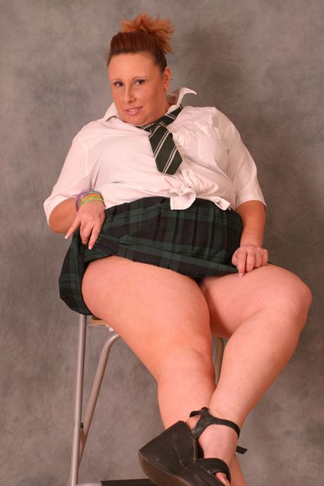 Attractive mature Charlie displays her amazing racks and ass before posing in her heels