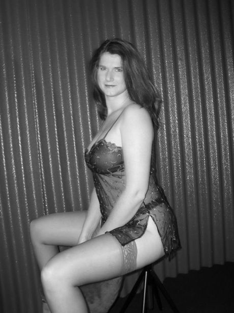 Angelic british Mommy Angel Eyes flaunts her big tits and spreads her shaved pussy