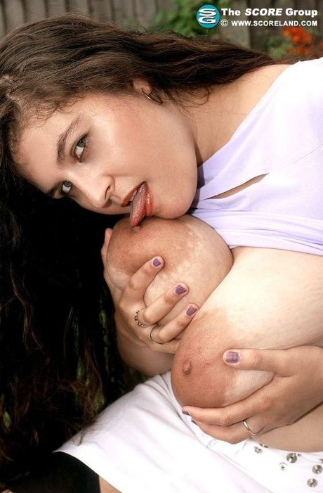 Busty british MILF Denise Davies presents her amazing tits and spreads her pussy outdoors