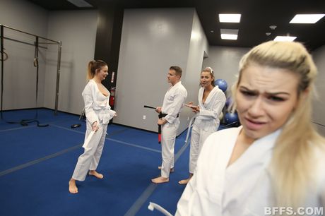 Three sexy girls share a dick during a foursome at a party