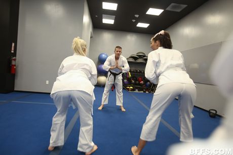 Three sexy girls share a dick during a foursome at a party