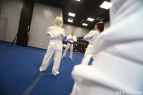 Three sexy girls share a dick during a foursome at a party