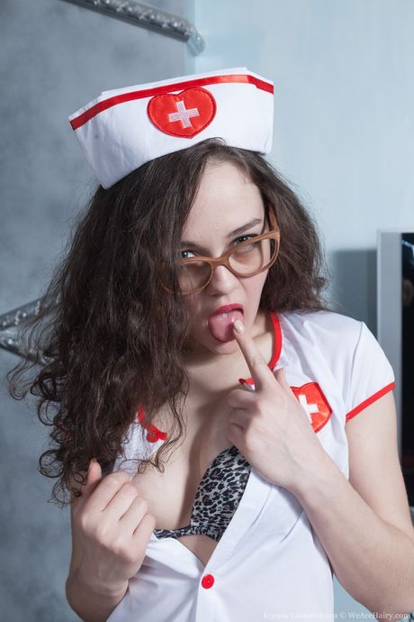 Naughty doctor Ksenia Yankovskaya strips and highlights her hairy pussy