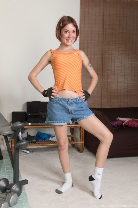 Glamour chick Ruby Ruthless strips and presents her hairy pussy in a solo